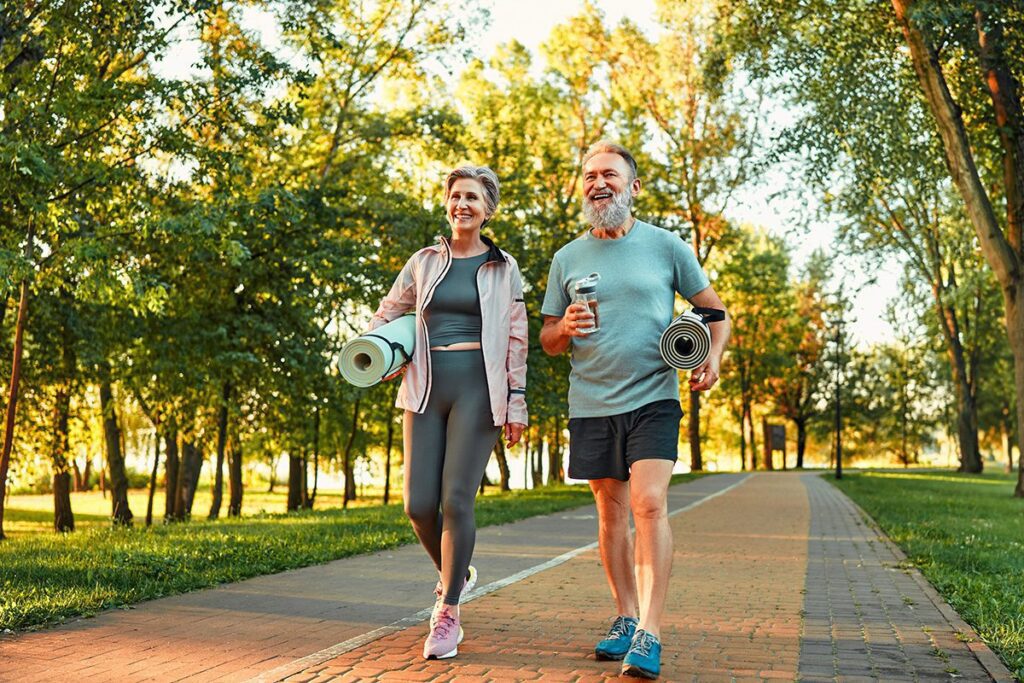 Beautiful sporty healthy active cheerful smiling middle aged couple