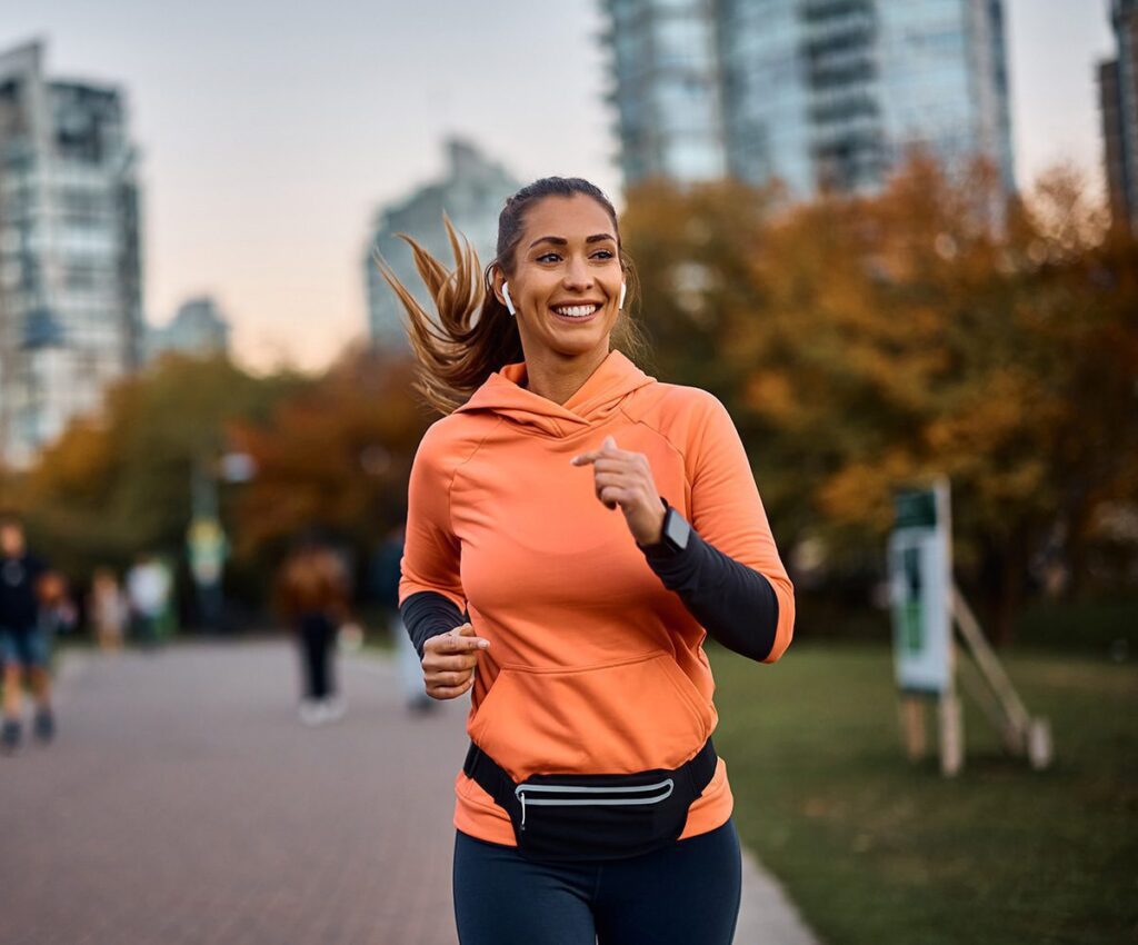 happy women running while listening to music