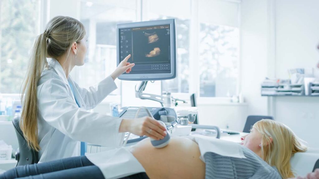 women getting an ultrasound in radiologist office