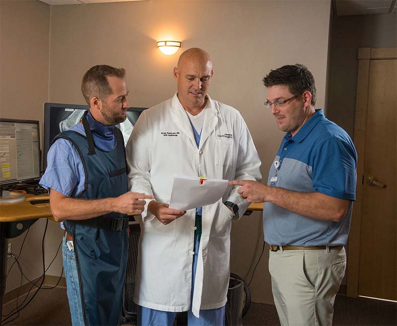 radiologist with patient in office